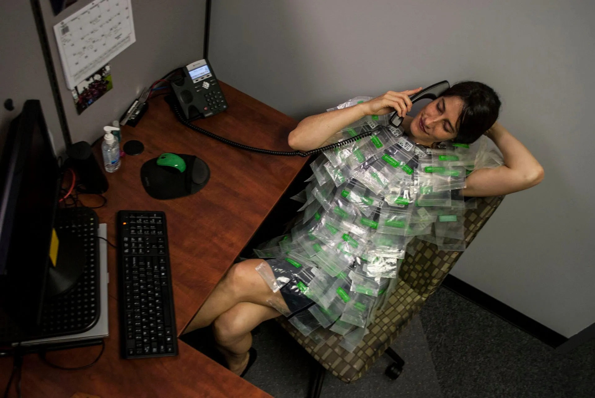 Reclining in the desk chair with the phone to my ear, the suit spread across my lap