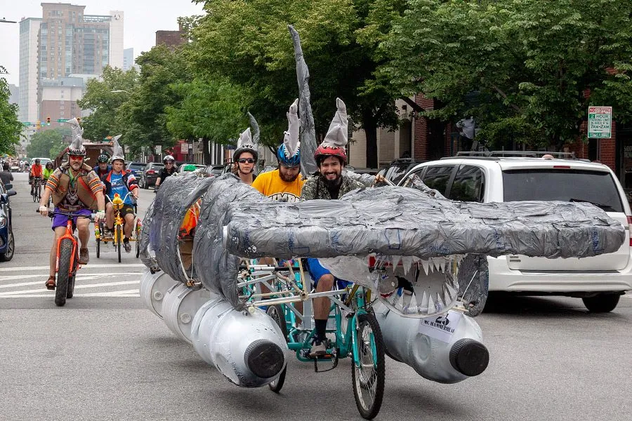 The kinetic version on the street, riders pedalling it forward