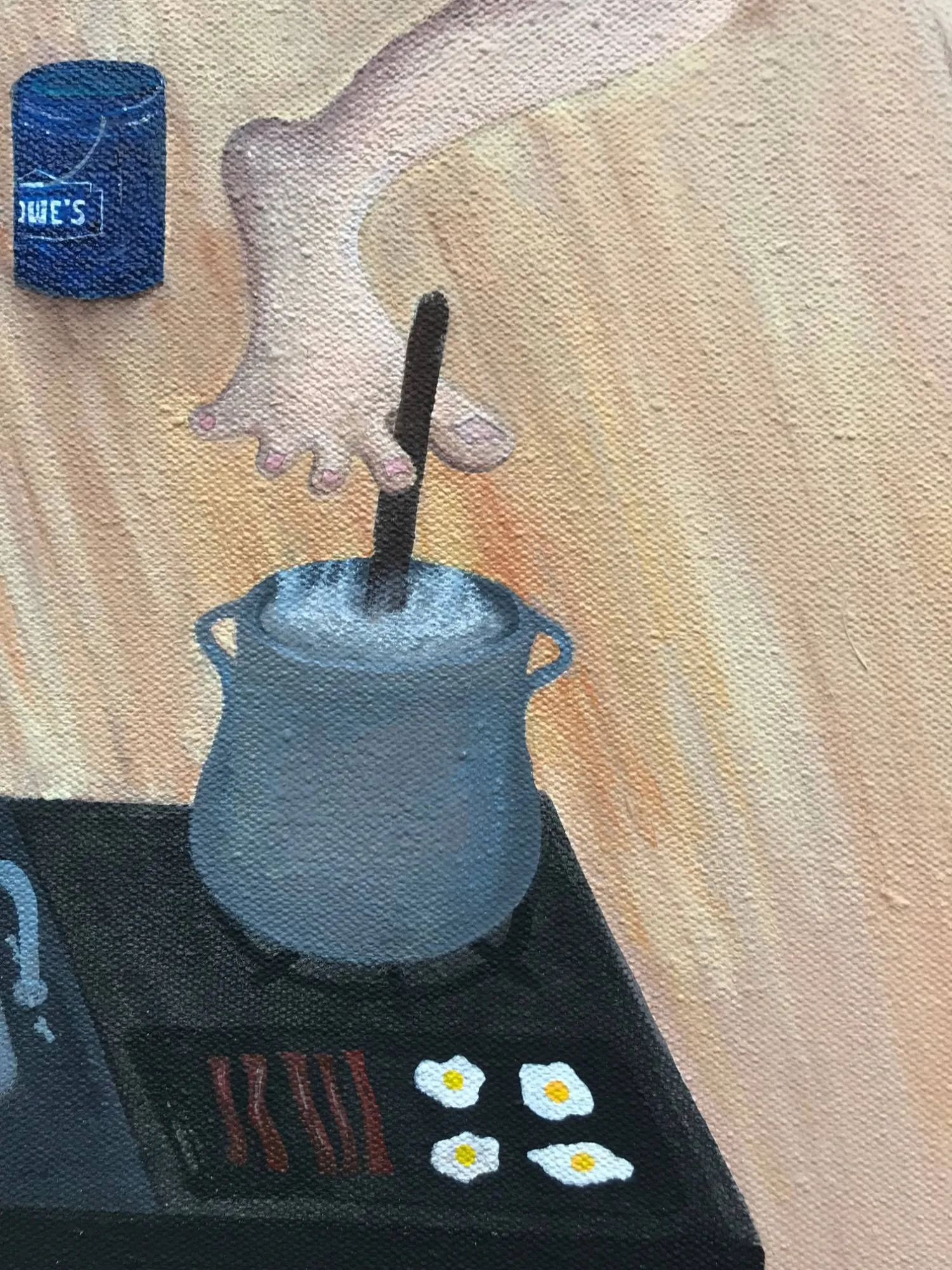 Detail of the painting, a foot curled around a spoon to stir a pot on the stove, eggs and bacon cooking beside it