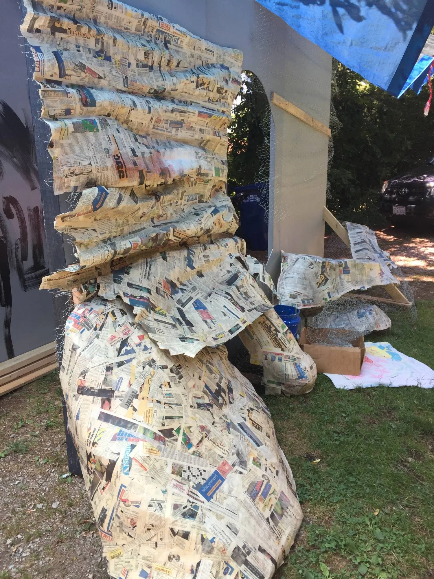 Newspaper papier-mâché built up over the wire into the shape of the rock face