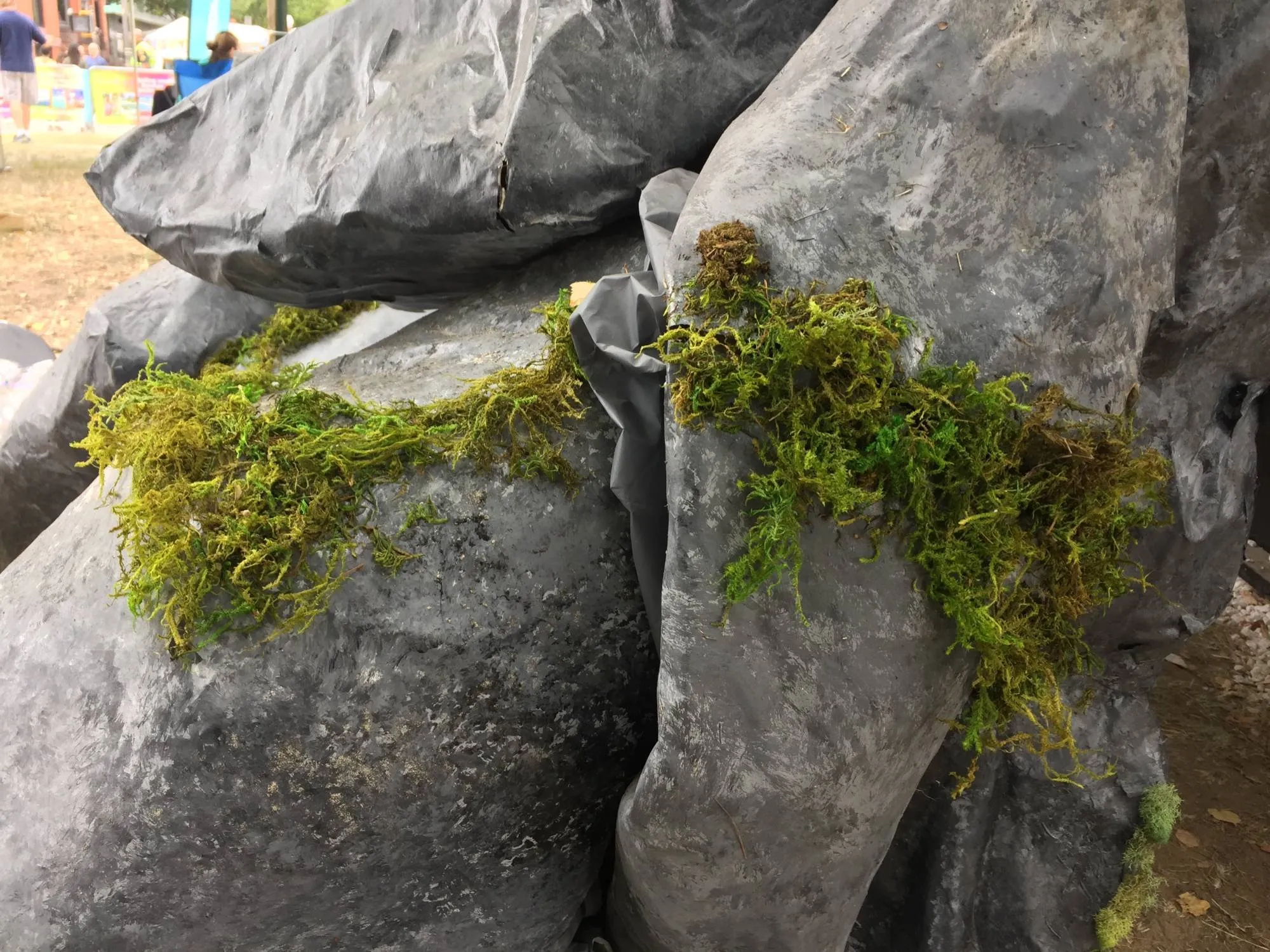 Moss laid into the seams between the finished boulders